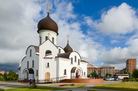 KLAIPEDA, LITHUANIA - JULY 11, 2015: Unidentified people are near the church in honor of the Protection of the Mother of God and in the name of Saint Nicholas (Pokrovo Nicholas Church), Klaipedaのeditorial素材