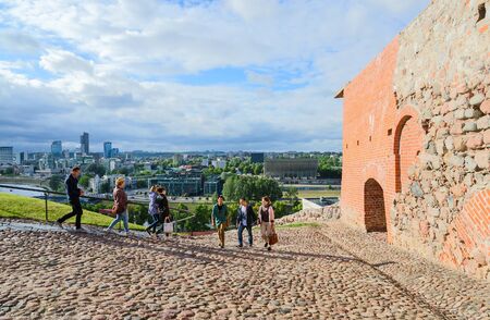 VILNIUS, LITHUANIA - JULY 10, 2015: Unidentified tourists climb on the Gediminas mountain on the rocky roadのeditorial素材