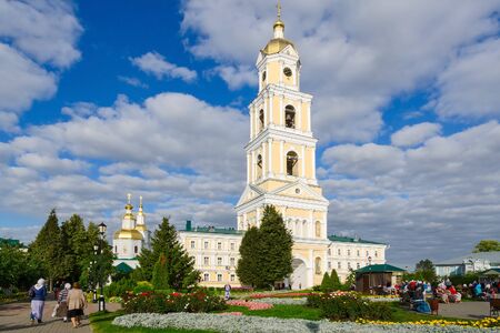 DIVEEVO, RUSSIA - AUGUST 22, 2015: Unknown pilgrims are on the territory of the Holy Trinity Seraphim-Diveevo monastery near the belfry, Diveevo, Russiaのeditorial素材