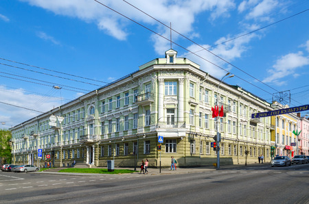 GOMEL, BELARUS - May 1, 2016: Unidentified people walk near the Administration Building (formerly Vilna Commercial Bank) on the corner of Streets Sovetskaya and Krestyanskaya, Gomel, Belarusのeditorial素材