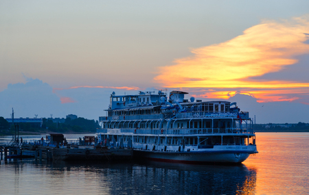 RYBINSK, RUSSIA - JULY 21, 2016: Cruise ship "Alexandre Benois" on river berth at sunset, Rybinsk, Russiaのeditorial素材