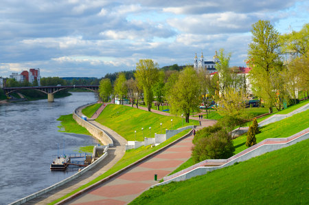 VITEBSK, BELARUS - MAY 16, 2017: Beautiful view of embankment of Western Dvina River, Kirovsky Bridge and Holy Dormition Cathedral in May, Vitebsk, Belarusのeditorial素材