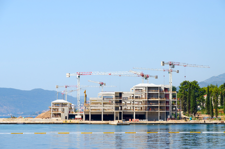 BAY OF KOTOR, MONTENEGRO - SEPTEMBER 16, 2015: Construction of new modern hotel on coast of Bay of Kotor, Montenegroのeditorial素材
