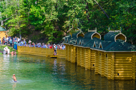 TSYGANOVKA, RUSSIA - AUGUST 22, 2015: Unknown pilgrims are on holy spring in name of Monk Seraphim of Sarov near village of Tsyganovka, Russiaのeditorial素材