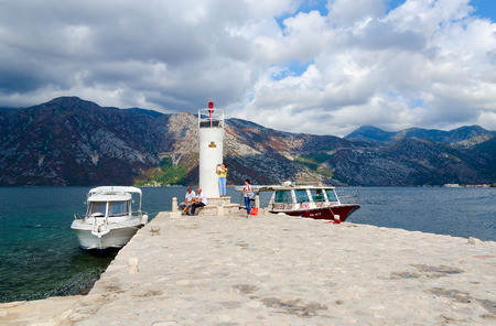 PERAST, MONTENEGRO - SEPTEMBER 10, 2017: Unknown tourists visit Island of Virgin on reef (Gospa od Skrpela Island), Montenegroのeditorial素材