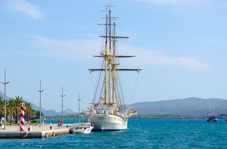 TIVAT, MONTENEGRO - SEPTEMBER 10, 2017: Beautiful view of sailing ship at seafront of resort town of...