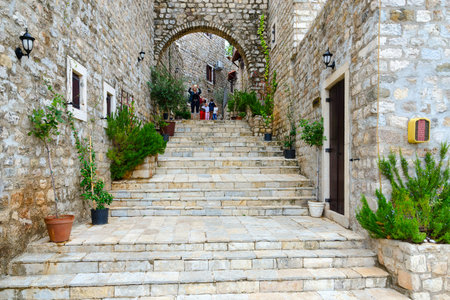 ULCINJ, MONTENEGRO - SEPTEMBER 9, 2017: Unknown tourists photograph urban view on street of Old Town, Ulcinj, Montenegroのeditorial素材
