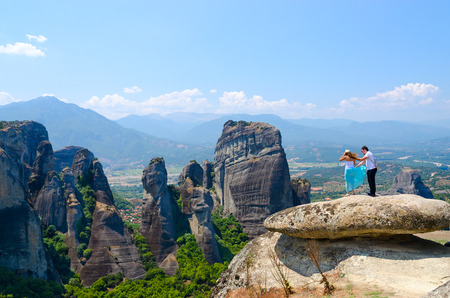METEORA, GREECE - AUGUST 11, 2014: Unidentified tourists are on viewing platform in famous Meteora, Greeceのeditorial素材