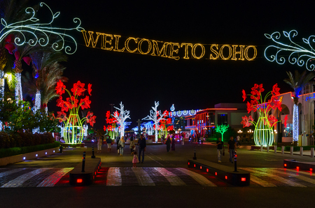 SHARM EL SHEIKH, EGYPT - MAY 8, 2018: Unknown tourists walk in evening in popular shopping and entertainment complex Soho Squareのeditorial素材