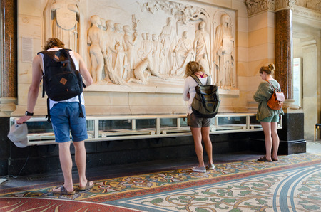 BERLIN, GERMANY - SEPTEMBER 5, 2018: Unknown young people are visiting exposition about history of Kaiser Wilhelm Memorial Church in old part of temple, Berlin, Germanyのeditorial素材