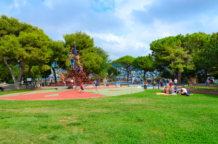 NICE, FRANCE - SEPTEMBER 15, 2018: Unidentified children play on children's playground in park on Roman hill (parc de la Colline du Chateau) in Nice, Cote d'Azur, Franceのeditorial素材