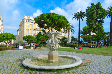 NICE, FRANCE - SEPTEMBER 15, 2018: Fontaine des Tritons in gardens of Albert I, Nice, Cote d'Azur, France. Unknown people relax outdoorsのeditorial素材