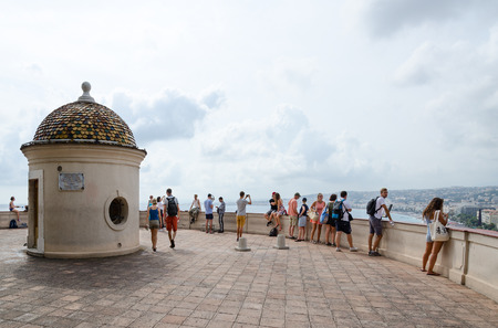 NICE, FRANCE - SEPTEMBER 15, 2018: Unidentified tourists on observation deck on Roman hill admire beautiful view of Promenade des Anglais in Nice, Cote d'Azur, Franceのeditorial素材