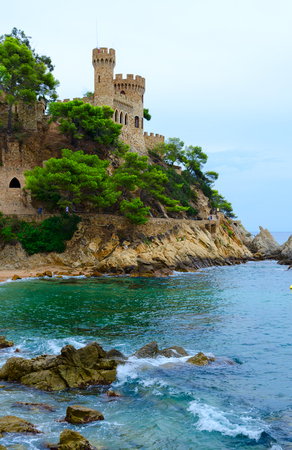 Beautiful view of castle on cliff near beach in Lloret de Mar, Costa Brava, Catalonia, Spainのeditorial素材