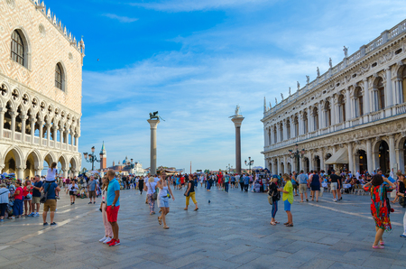 VENICE, ITALY - SEPTEMBER 16, 2018: Unknown tourists are on famous Piazza San Marco near Doge's Palace and Marciana Library, Venice, Italyのeditorial素材