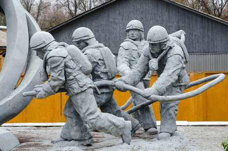 CHERNOBYL, UKRAINE - NOVEMBER 11, 2018: Fragment of monument to firefighters who participated in liquidation of consequences of accident at Chernobyl nuclear power plant ("Those who saved world")のeditorial素材