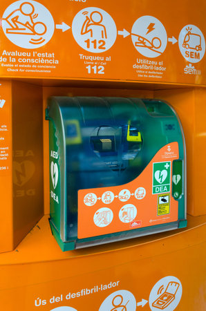 GIRONA, SPAIN - SEPTEMBER 11, 2018: Automatic external defibrillator on street, Girona, Spain