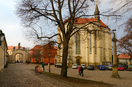 PRAGUE, CZECH REPUBLIC - JANUARY 22, 2019: Church of St. Roch (MIRO art gallery), Strahov Monastery. Unidentified people visit monastery courtyardのeditorial素材
