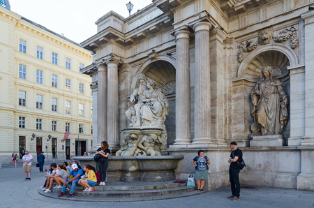 VIENNA, AUSTRIA - SEPTEMBER 17, 2018:  Unknown tourists are resting on steps of Albertina Gallery in historical center of city, Vienna, Austriaのeditorial素材