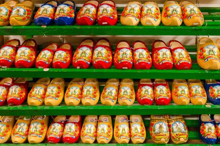 AMSTERDAM, NETHERLANDS - SEPTEMBER 6, 2018: Traditional Dutch wooden shoes (klompy) on shelves in souvenir shop, Amsterdam, Netherlandsのeditorial素材