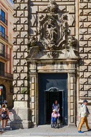 BARCELONA, SPAIN - SEPTEMBER 13, 2018: Unidentified people walk along pedestrian street La Rambla near church of Our Lady of Bethlehem (Parroquia de la Verge de Betlem), Barcelona, Spainのeditorial素材