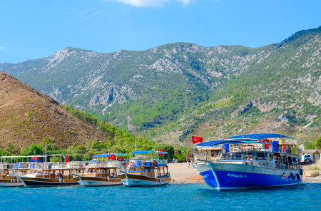 ADRASAN BAY, TURKEY - SEPTEMBER 22, 2022: Pleasure boats in Adrasan bay in Mediterranean Sea. Excursion "Turkish Maldives" during holiday in Turkeyのeditorial素材