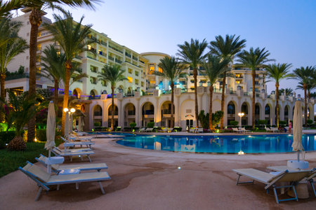 SHARM EL SHEIKH, EGYPT - SEPTEMBER 15, 2020: Territory of popular Stella Di Mare Sharm Beach Hotel & Spa 5 * in Naama Bay, Sharm El Sheikh, Egypt. Main building and pool, evening viewのeditorial素材