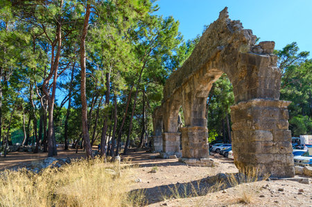 CAMYUVA, TURKEY - SEPTEMBER 25, 2022: Ruins of aqueduct in ancient city of Phaselis, Turkeyのeditorial素材