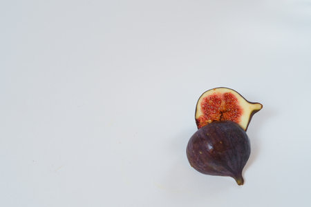 Food. Exotic fruit. Purple figs close up on a white background.の写真素材