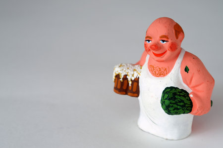 Funny figurines of ceramics, plaster and clay. The man in the bath.の写真素材