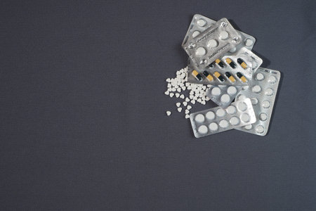 Medications on fabric background.