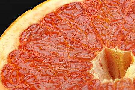 Food. A macro-beam of ripe grapefruit cut. The texture of citrus fruits. High quality photoの写真素材