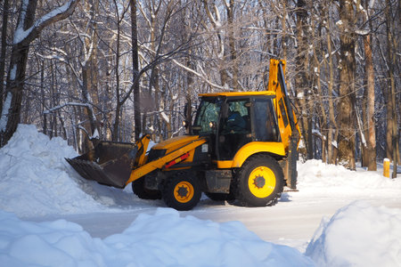 Snow removal with special equipment. Winter, lots of snow. Special equipment for cleaning snow from...