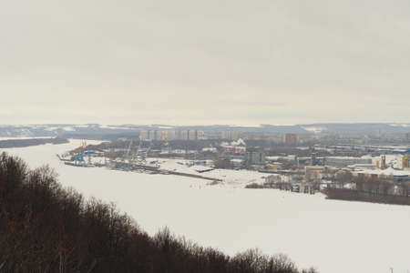 Frozen river, Industrial pride by the river, production, factories and nature. High quality photoの写真素材