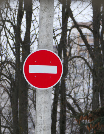 A road sign on a pole. Passage is forbidden, round white on red. High quality photoの写真素材