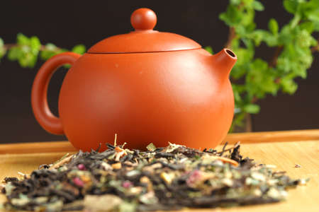 Leaf tea, willow tea, brewed in a clay brown teapot. High quality photoの写真素材
