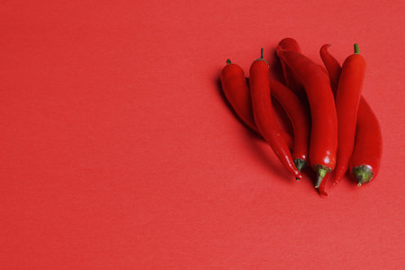 Pepper pod red isolated on a red background. High quality photoの写真素材