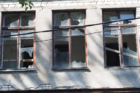 Ruined houses and old dilapidated buildings, houses with broken windows. Consequences of explosions...