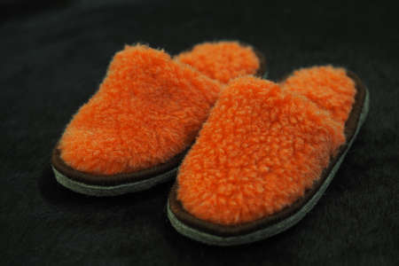 Comfortable indoor slippers on a soft carpet. The concept of comfort, warmth and coziness. High quality photoの写真素材