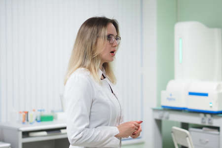 Nizhny Novgorod, Russia, Gagarin Avenue 23 , Lobachevsky University, 01.29.2022. A young girl, a scientist in a scientific biochemical laboratory in a white coat. high quality photoのeditorial素材
