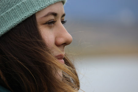 Portrait of a girl of European appearance with long hair on the street. high quality photoの写真素材