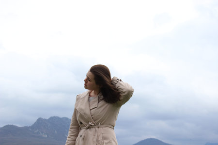 A girl of European appearance in nature, in the mountains. High quality photo