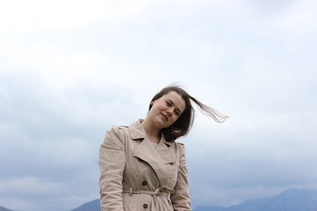 A girl of European appearance in nature, in the mountains. High quality photo