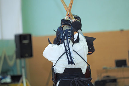 Kendo. The Championship. Athletes in protective gear with swords and a helmet on their heads. High quality photoの写真素材