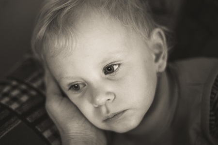 portrait of a child. black and white. sorrowの写真素材