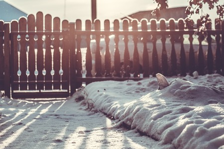 sunny winter morning patio. carved wooden fenceの写真素材