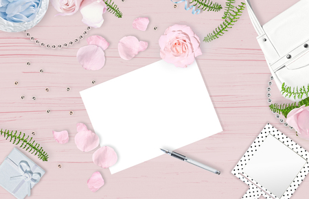 Flat lay. Feminine background with white sheet for text. Wooden pink backgroundの写真素材