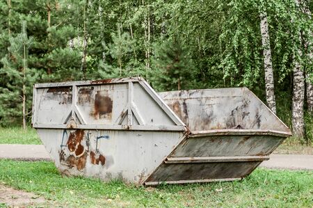 Garbage bin in park. One garbage in forest on the grassの写真素材