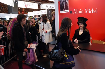 PARIS - MARCH 14: French/Belgian fiction writer Amelie Nothomb signs her  book Tokyo Fiancee and meet fans at the International Book Fair - Salon du Livre 2009 on March 14, 2009 in Paris, Franceのeditorial素材