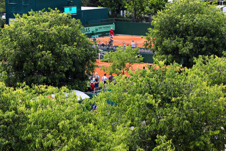 PARIS - MAY 21: Roland Garros 2011 atmosphere - courts of the French Open Grand Slam tennis tournament and behind the green trees on May 21, 2011 in Paris, France.のeditorial素材